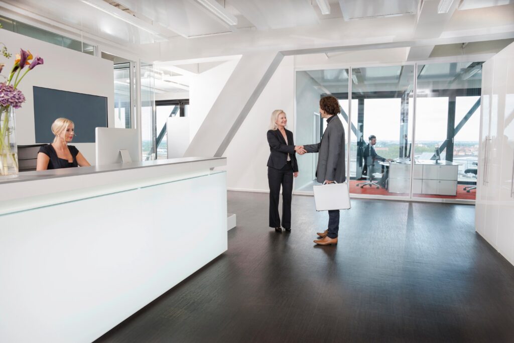 Woman shaking hands with visitor at reception 2026 01 09 09 53 48 utc pichi